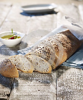 Loaf of bread serving with olive oil