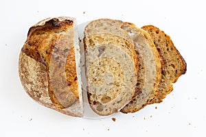 Loaf bread with slices bread on white background top view