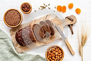 Loaf with dried fruits and nuts. Healthy homemade bread top view