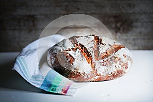 Loaf of rye artisan sourdough bread, rustic kitchen
