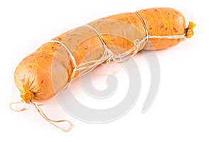 Loaf of sausage bandaged with string on a white background isolated.