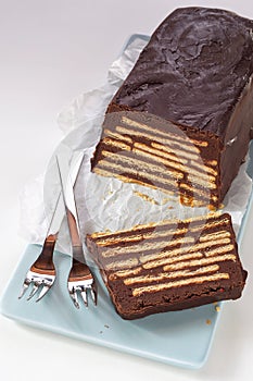 Loaf-shaped chocolate cake with biscuits