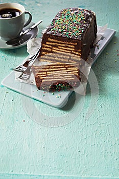 Loaf-shaped chocolate cake with topping