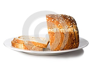 Loaf of sliced bread on plate.