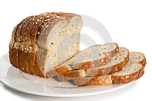 Loaf of sliced bread on plate. photo