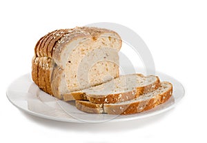 Loaf of sliced bread on plate.