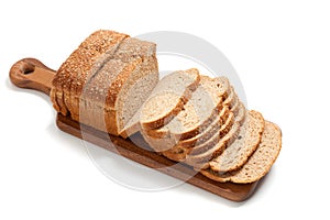 Loaf of whole grain bread on a board