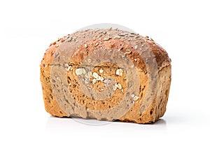 Loaf of wholegrain bread over white photo