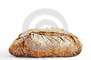 Loafs or miche of French sourdough, called as well as Pain de campagne, on display isolated on a white background. photo