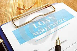 Loan agreement form with clipboard