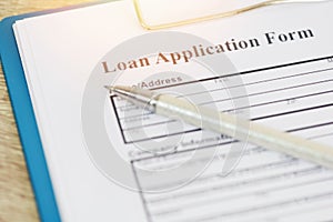 Loan application form, Financial loan money contract agreement company credit or person with a pen filling in information