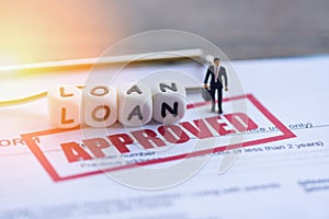 Loan approval / Businessman financial Standing on loan application form for lender and borrower