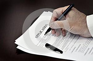 Loan Contract Document on Desk with Black Pen