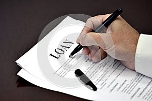 Loan Document Agreement on Desk with Pen