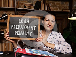 LOAN PREPAYMENT PENALTY inscription on the board