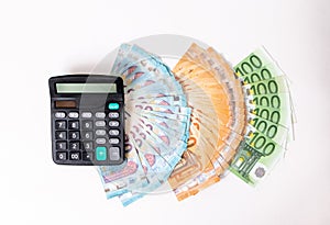 Loans and debts concept. Euro banknotes Laid out in a fan on white background. Money finance earning sector concept. Copy space fo photo