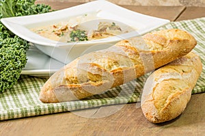 Loaves of bread with bowl of soup