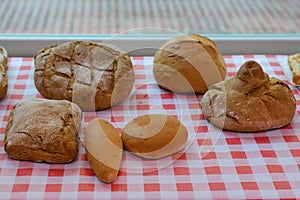 Loaves of bread on a checkered tablecloth