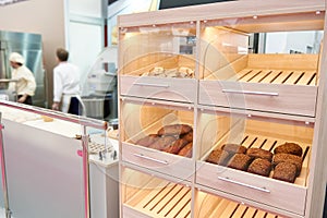 Loaves of bread on shelf in bakery