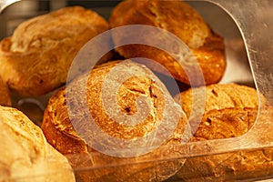 Loaves of fresh bread on the counter in a store. Traditional delicious pastries. Close-up