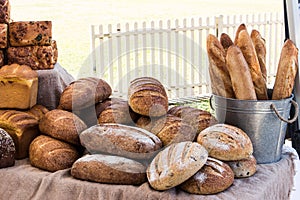 Loaves of freshly baked wholemeal and sourdough bread