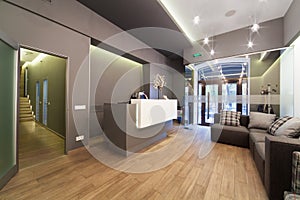 Lobby entrance with reception desk in a dental clinic. photo