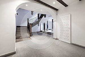 Lobby of a vintage residential apartment building with a large interior atrium