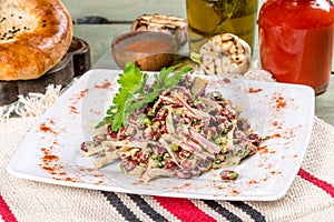 Lobio salad on a white plate shot in the decor