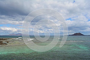 Lobos Island in emeral waters. Corralejo, Fuerteventura, Spain