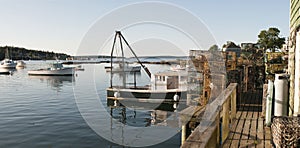 Lobster boat and pots on wharf