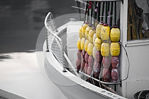 Lobster buoys hanging on a boat in big shore near