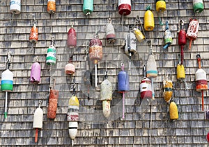 Lobster buoys on wall of building in Maine