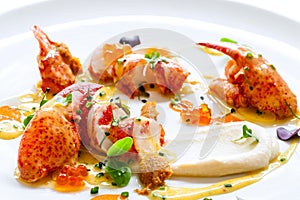 Lobster with caviar and seafood dressings.