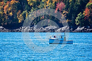 Lobster fishing boat in autumn in coastal Maine, New England