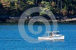 Lobster fishing boat in autumn in coastal Maine, New England