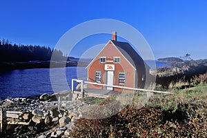 Lobster house on edge of Penobscot Bay in Stonington ME in Autumn photo