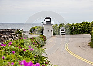 Lobster point lighthouse along the rocky coast of Maine on the Marginal Way path in Ogunquit photo