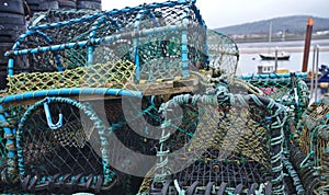 Lobster Pots in a coastal fishing town with boat in the background