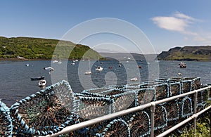 Lobster pots on the scenic Portree Harbour, Isle of Skye in the Scottish. Highlands, UK