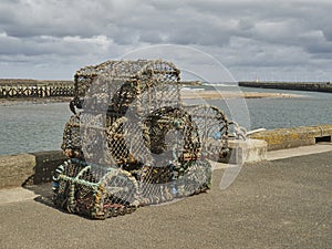 Lobster Pots Stacked On The Edge Of A Pier