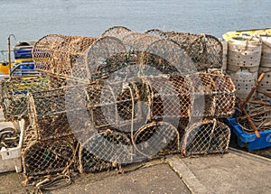 Lobster pots stacked on the quayside