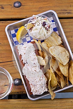 Lobster Roll with Potato Chips and Coleslaw