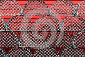 Lobster traps against red wall