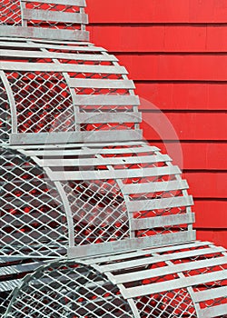 Lobster traps against red wall