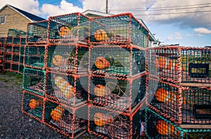 Lobster traps and buoys on a wharf