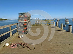 Lobster traps stacked on pier Cape Porpoise Maine photo