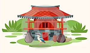 Local bird of island on background of red building in oriental style. Landscape of Jeju in Korea