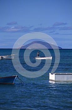 Local boat with fisherman at Mauritius Island