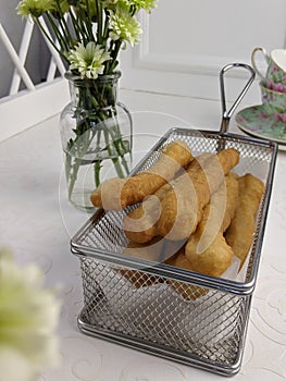 local breadstick called cakoi or youtiao a long golden brown deep fried strip of dough served for tea time