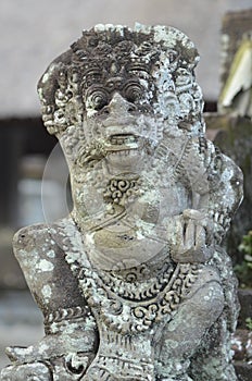 Local carved stone statue in Bali Asia Indonesia